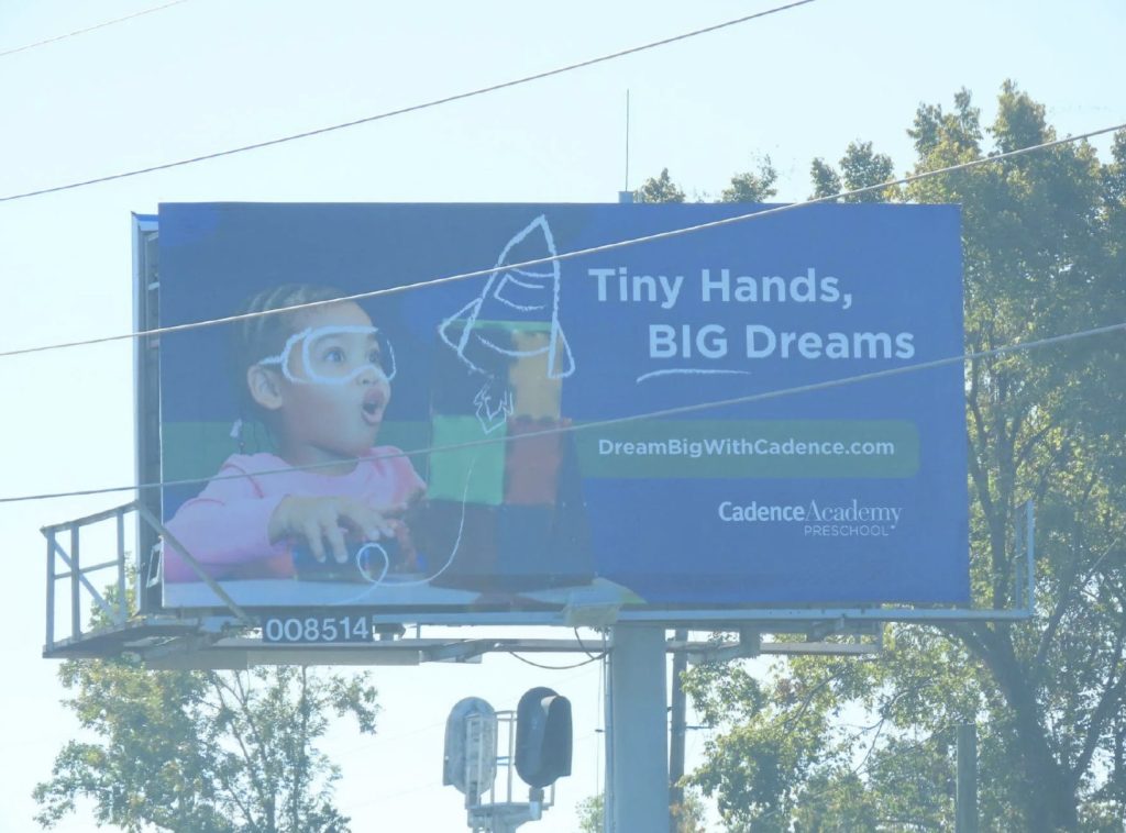 Static billboard promoting preschool academy